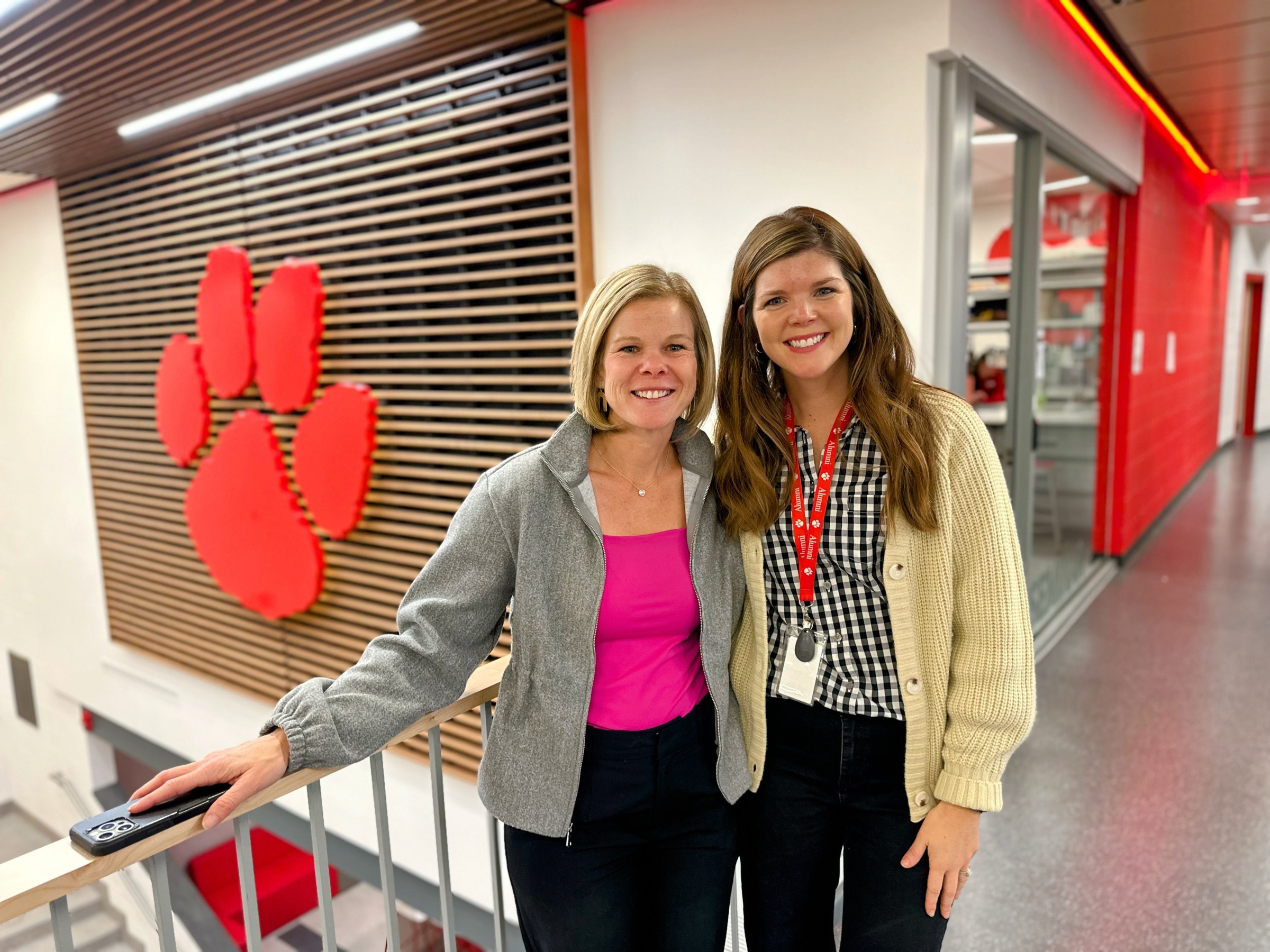 Two staff members in Beechwood hallway